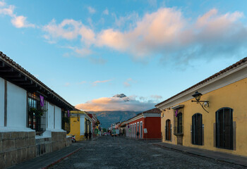 Fototapeta na wymiar Antigua city street at sunrise with Agua volcano, Guatemala.