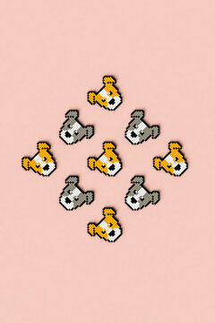 Pixelated dogs on pink background. copy spaced.