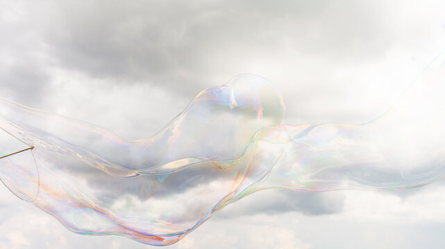 A giant bubble against a cloudy sky