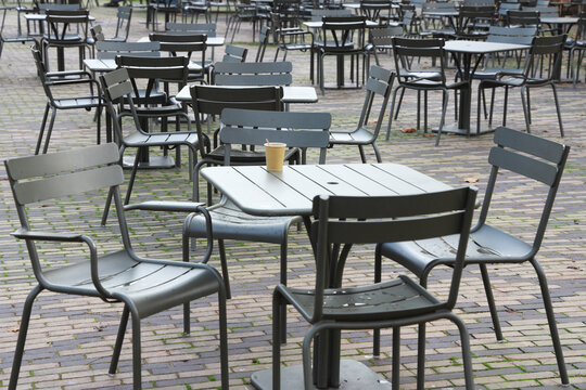 empty tables and chairs
