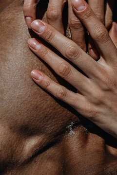 The Hand Of White Woman Lying On The Chest Of Black Man