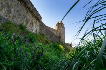 View of the observation towers of the medieval fortified Castle of Fougeres.Blue sky on a clear sunny summer day. City of Fougeres, department of Brittany,France.