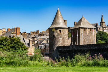 View of the observation towers of the medieval fortified Castle of Fougeres.Blue sky on a clear sunny summer day. City of Fougeres, department of Brittany,France.