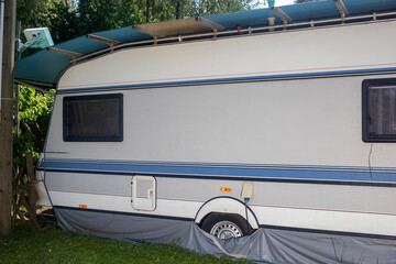 Camping caravan with a blue stripe