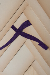 purple X on old, faded paper 