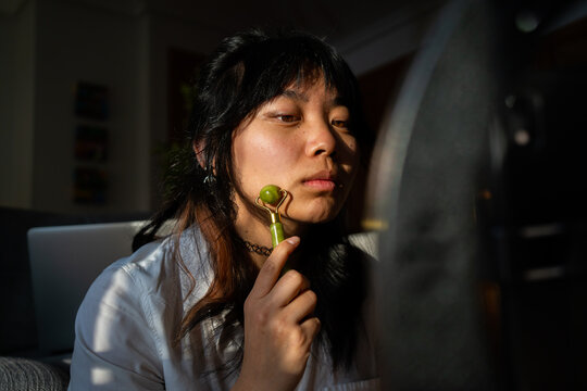 Face Of An Asian Woman Doing Cosmetic Routine.