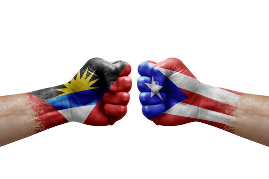 Two hands punch to each others on white background. Country flags painted fists, conflict crisis concept between antigua and barbuda and puerto rico