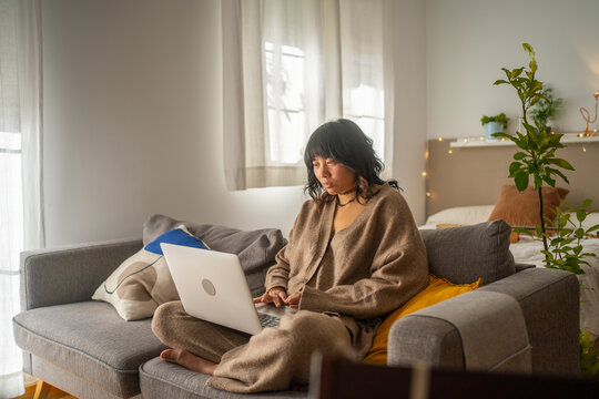 Asian Girl Working From Home With Laptop.
