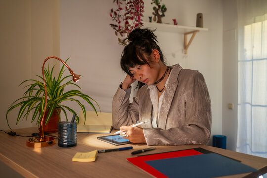 Stylish Asian Woman, Working From Home At Sunset. 
