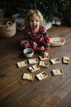 Excited Toddler with educational math toy on Christmas