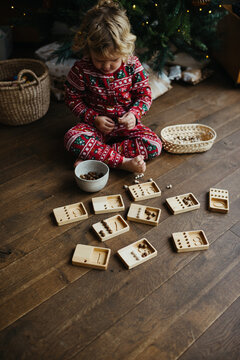 Toddler learning how to count with wooden toy