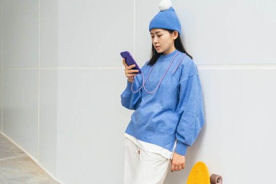 Young woman using her phone