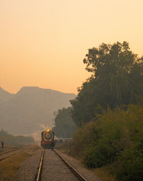 A steam train at dusk