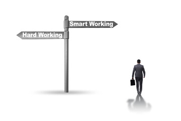 Businessman at the crossroads on working smart or hard