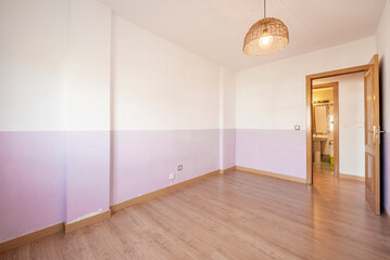 empty room with two types of paint on the walls and French oak carpentry