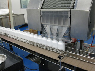 Naklejka premium bottles in pharmaceutical production clean room