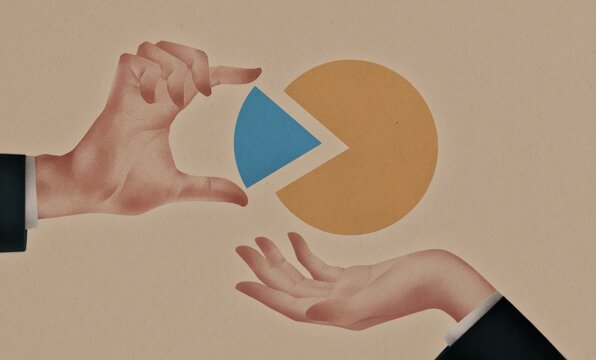 Businessmen holding pie chart