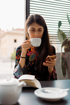 Woman using a smartphone in a bar