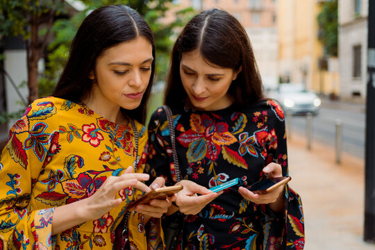 Girlfriends buying things online