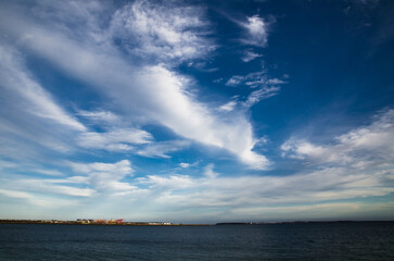 Beautiful cloudy sky with dark blue ocean view.