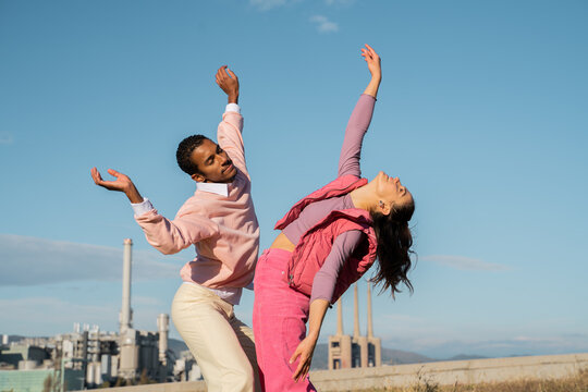 Friends dancing outdoors