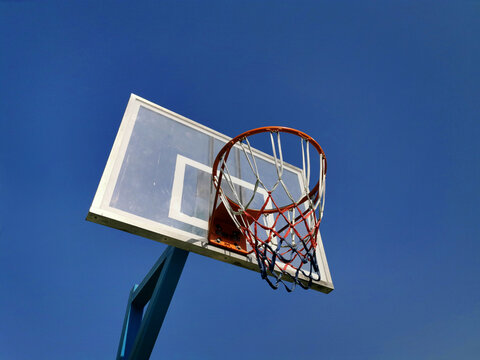 outdoor basketball hoop and blue sky