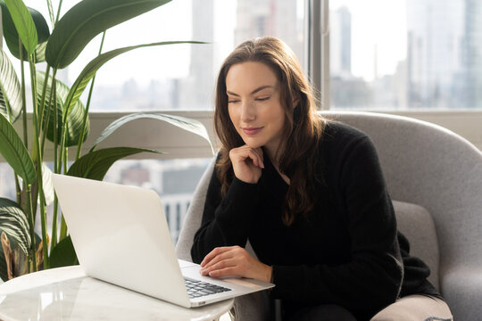 Young woman working on laptop computer