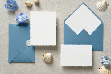 Wedding stationery set. Nautical wedding invitation cards mockups and blue envelopes with seashell...