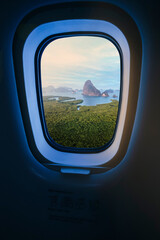 Concept image of touring and transportation, airplane's window with Samed Nang Shee ariel view in...