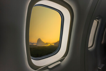 Concept image of touring and transportation, airplane's window with Samed Nang Shee ariel view in...