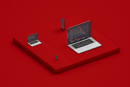 Laptops and smartphones showing stock market statistics on screen