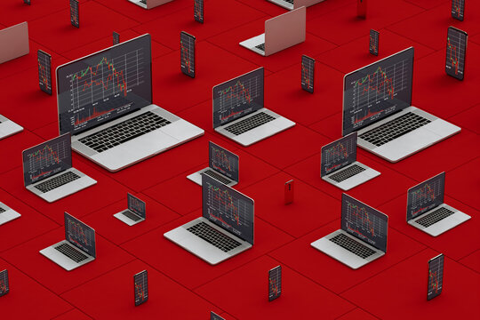 Laptops and smartphones showing stock market statistics on screen