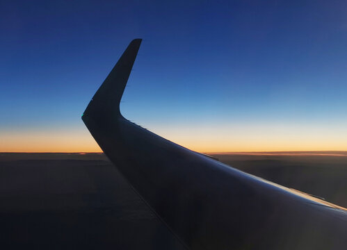 blu sky, sunset horizon line and airplane wing