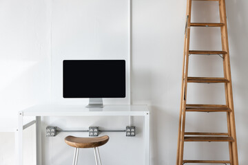 desk with monitor and wood ladder in photo studio 