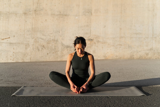 Woman Practicing Yoga Outdoor