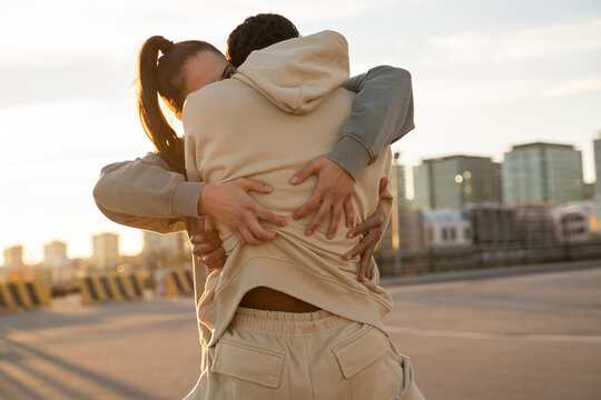 Close-up detail of hugging couple