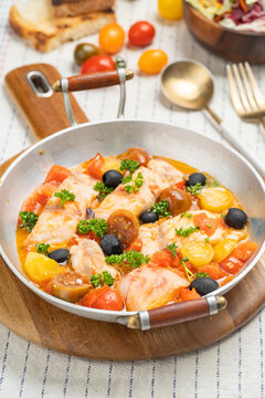 Cod fish fillet in tomato sauce
