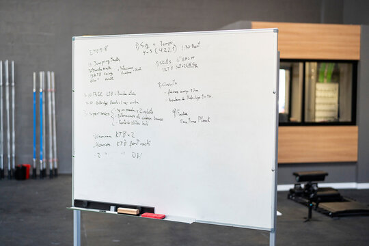 Whiteboard with training plan in gym