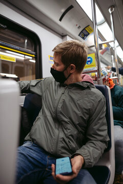 Man on subway train.