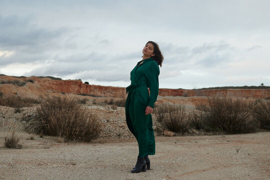 woman at desert wearing a green dress