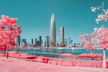 Infrared photography of plants with cityscape by sea