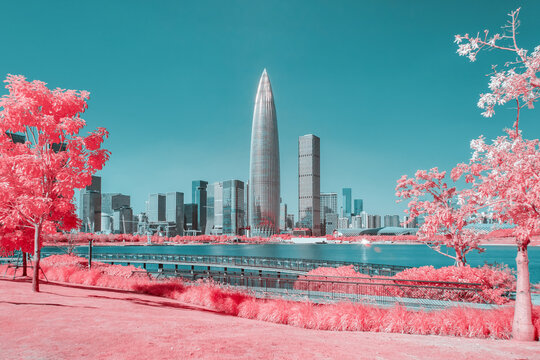 Infrared photography of plants with cityscape by sea