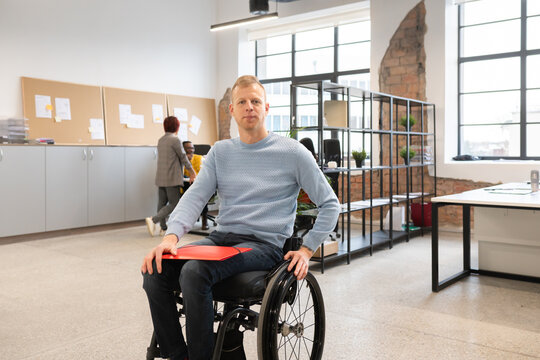 Self-confident Man With Disability At Office