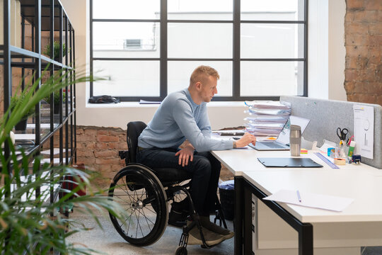 Businessman With Disability Working At Office 