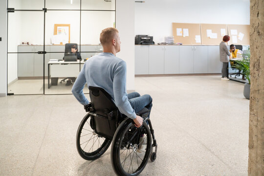 Man On Wheelchair Coming To Work