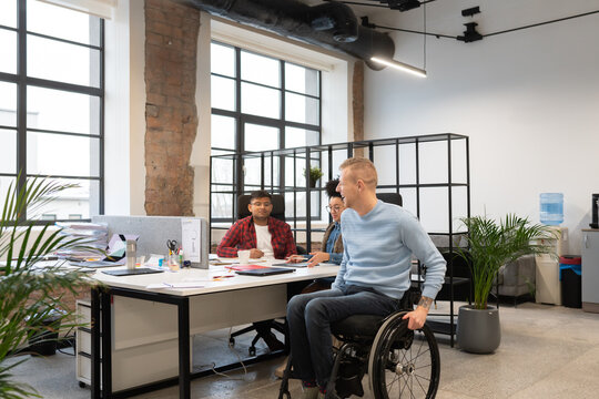 Man With Disability Coming To His Desk