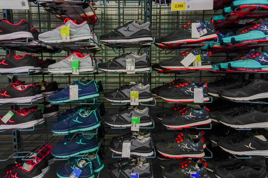 ULUBERIA, HOWRAH, WEST BENGAL / INDIA - 18TH MARCH 2018 : Sports shoes are on display at Dechathlon S.A. - world's largest sporting goods retailer. Clerance sale - editorial stock image.