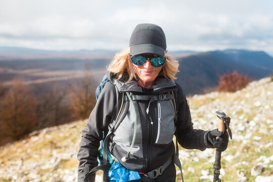 Happy female hiker walking towards camera