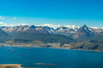 Fototapeta na wymiar Argentina, Tierra del Fuego, view from the plane on the amazing mountain landscape and the city of Ushuaia