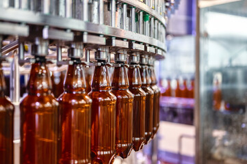 Filling plastic bottles with various drinks on an automatic filling machine